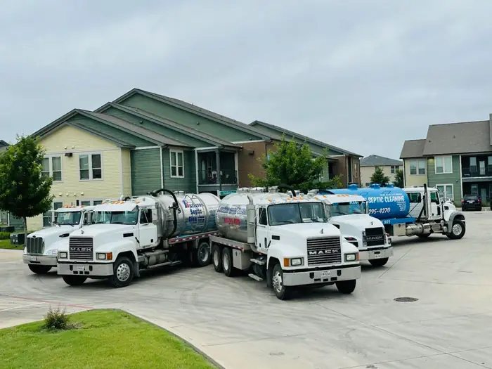 Burleson Septic vacuum trucks loaded and staged before the first call of the day