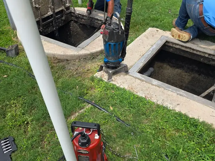 Burleson Septic technicians servicing a lift station