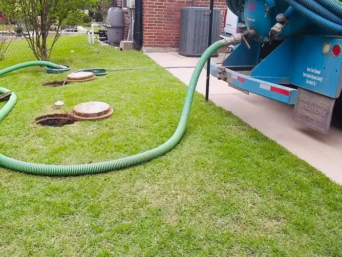 A Burleson Septic service truck on a residential job