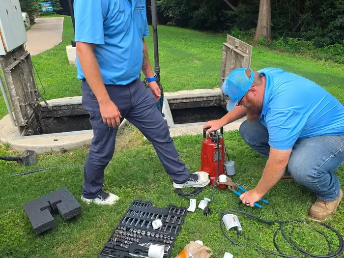 A Burleson Septic technician performing a septic system inspection